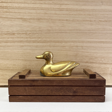 Load image into Gallery viewer, Another photo of the brass duck nursery decoration