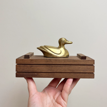 Load image into Gallery viewer, Vintage Nursery Decoration is a wood box with a brass duck on top and inside the box is a set of dominos