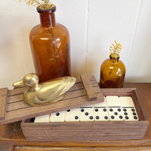 Load image into Gallery viewer, Brass duck nursery decor styled with glass bottles and simple faux flowers