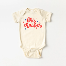 Load image into Gallery viewer, Baby onesie with red 'fire cracker' text and blue and red stars on a white background.