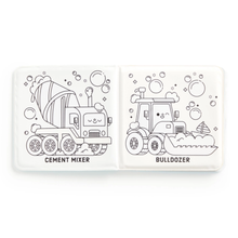 Load image into Gallery viewer, The inside pages of a bath book shown open flat, featuring two black line drawings of construction vehicles: a cement mixer on the left and a bulldozer on the right, each with bubbles around them and the vehicle names printed below.