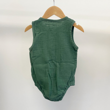 Load image into Gallery viewer, The back view of a baby boy bubble romper in the color moss green, hanging on a wooden hanger in front of a white background inside Gracie Lou, children's boutique.
