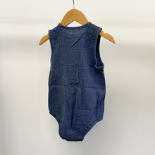 Load image into Gallery viewer, A baby boy, blue cotton bubble romper on a baby hanger in front of a white background.