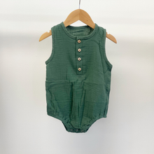 Load image into Gallery viewer, A baby boy bubble romper in the color moss green, hanging on a wooden hanger in front of a white background inside Gracie Lou, children's boutique.