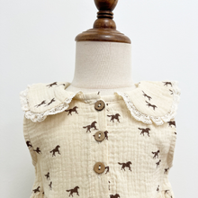Load image into Gallery viewer, A close up of the collar on a western inspired baby girl bubble romper on a mannequin in front of a white wall.