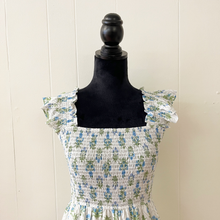 Load image into Gallery viewer, Floral dress on a black mannequin against a white wall
