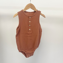 Load image into Gallery viewer, An infant size, baby boy bubble romper, on a baby hanger in front of a white wall.