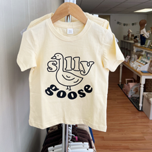 Load image into Gallery viewer, A Silly Goose tee shirt hanging inside a children's boutique