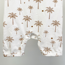 Load image into Gallery viewer, A detail picture of the snap closure at the bottom of a baby boy jumpsuit in white with a brown palm tree pattern, against a light gray background.