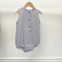 Load image into Gallery viewer, An infant baby romper with front buttons, hanging on a wooden hanger in front of a white background inside Gracie Lou, "A Boutique For Littles".