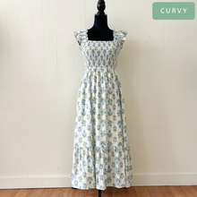 Load image into Gallery viewer, Floral dress on a mannequin against a white wall with 'CURVY' label.