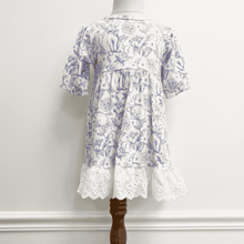 Load image into Gallery viewer, White dress with blue floral and bunny pattern on a mannequin against a white background