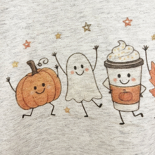 Load image into Gallery viewer, A close-up of a light heather gray toddler tee shirt featuring a cute autumn graphic print with a smiling orange pumpkin, a white ghost, and a coffee cup character with whipped cream and an orange pumpkin motif.