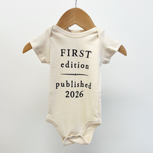 Load image into Gallery viewer, Baby onesie with 'First edition published 2026' text on a white background