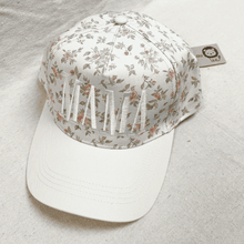 Load image into Gallery viewer, Floral-patterned cap with white brim on a light gray background