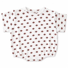 Load image into Gallery viewer, A white short-sleeve baby boy romper with an all-over repeating pattern of brown footballs, shown flat against a white background.