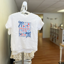 Load image into Gallery viewer, A toddler girls white t-shirt with a design to celebrate America 250 or 4th of July on a clothing rack inside Gracie Lou children's boutique.