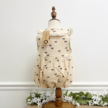 Load image into Gallery viewer, The back view of a western inspired baby girl bubble romper on a mannequin in front of a white wall.