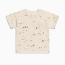 Load image into Gallery viewer, A short-sleeve toddler t-shirt in cream with a delicate, all-over watercolor-style print of boats, sailboats, ships, and small trees. The shirt features a classic crew neck and a left chest pocket, presented flat against a clean white background.