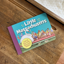 Load image into Gallery viewer, A board book titled 'Little Massachusetts' laying on a vintage school desk.