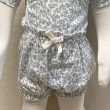 Load image into Gallery viewer, Floral-patterned baby romper and bloomers on a mannequin against a neutral background