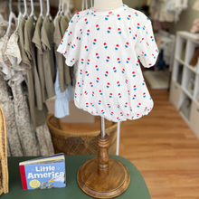 Load image into Gallery viewer, An infant mannequin, inside Gracie Lou children's boutique, wears a baby bubble romper, with a repeated bomb pop popsicle pattern.