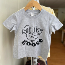 Load image into Gallery viewer, A heather gray Silly Goose tee shirt on a rack inside a children's boutique