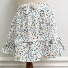 Load image into Gallery viewer, Floral patterned skirt on a mannequin against a neutral background