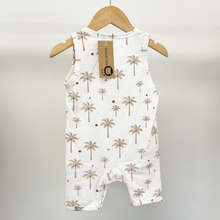 Load image into Gallery viewer, The back view of an infant boy romper in white with a brown palm tree pattern, hanging on a wooden hanger against a light gray background.