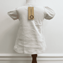 Load image into Gallery viewer, Shell Colored A-line tee shirt on a toddler mannequin with a 'Gracie Lou' tag against a plain background