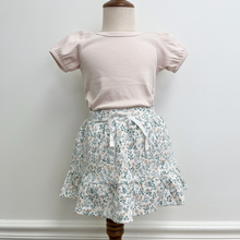 Load image into Gallery viewer, Mannequin wearing a light pink (color: Shell) top and floral skirt against a plain background