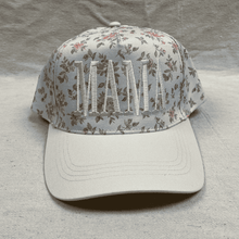 Load image into Gallery viewer, Floral-patterned cap with 'MAMA' embroidery on a textured surface