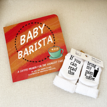 Load image into Gallery viewer, The book, Baby Barista, laying on a white background and laying beside a pair of baby socks that say "If you can read this, bring my mom a coffee".