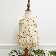 Load image into Gallery viewer, A western inspired baby girl bubble romper on a mannequin in front of a white wall.