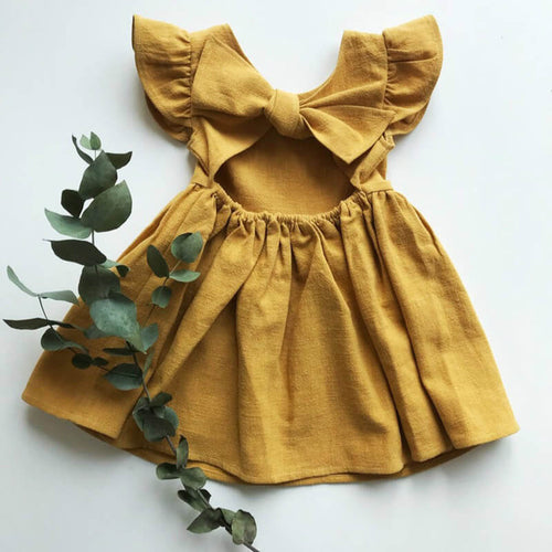 Dress featuring a back bow in the color ginger at Gracie Lou | A Boutique For Littles